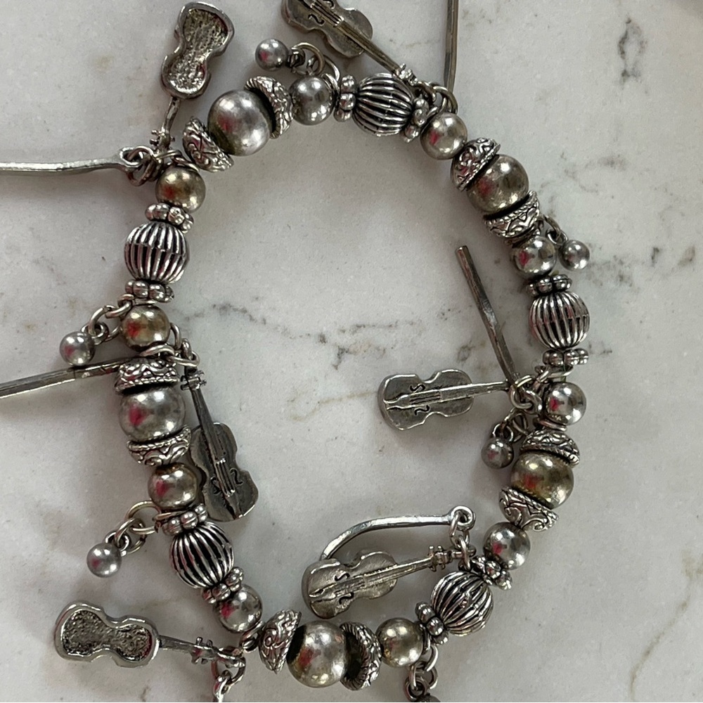 Silver tone  Charm Bracelet with Musical Accents